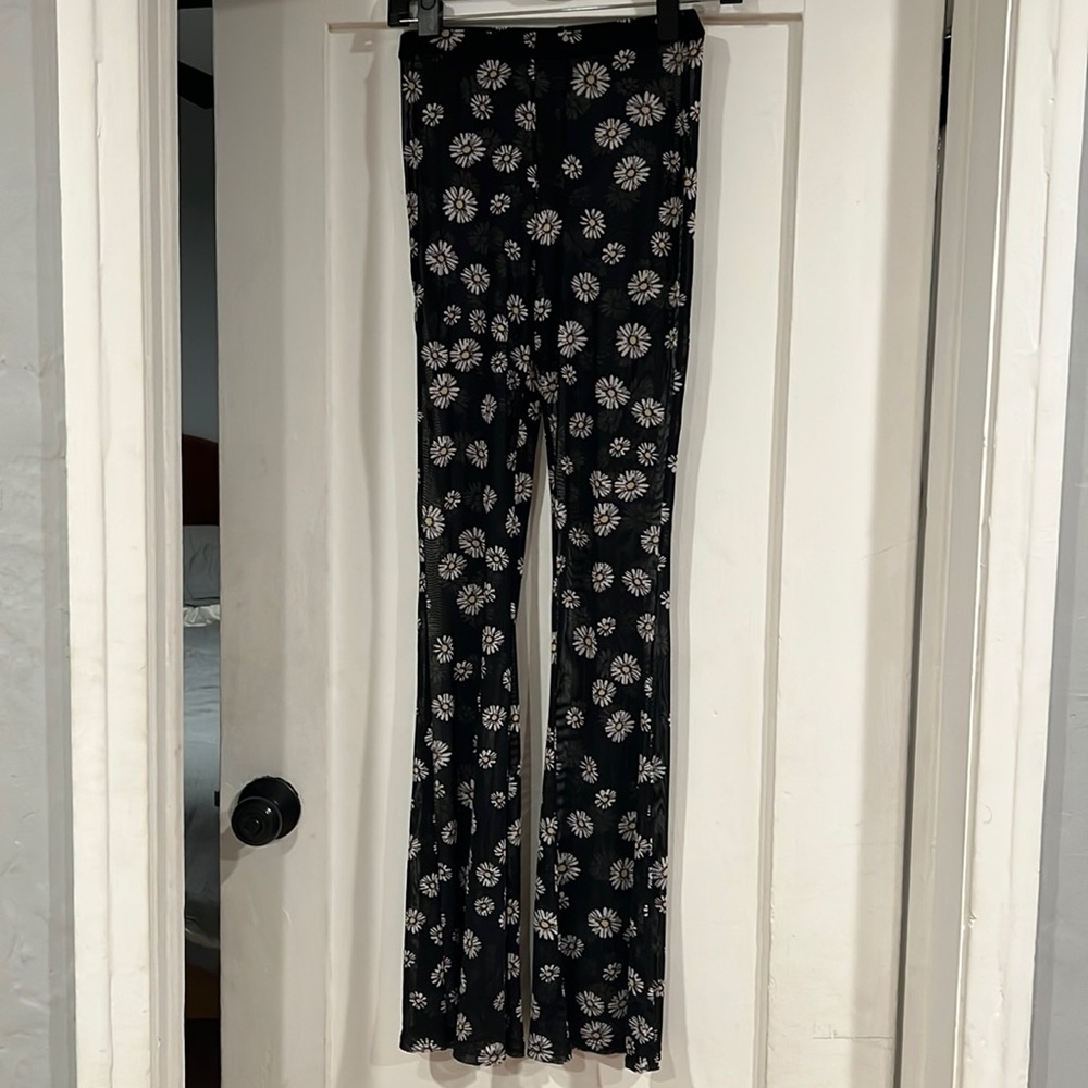 Black daisy transparent flare pants
